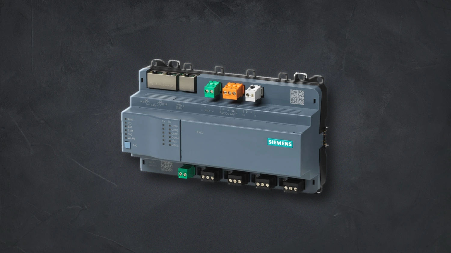 Siemens Desigo building automation controller — a DIN-rail module with RJ45 ports and coloured terminal blocks, on a dark background